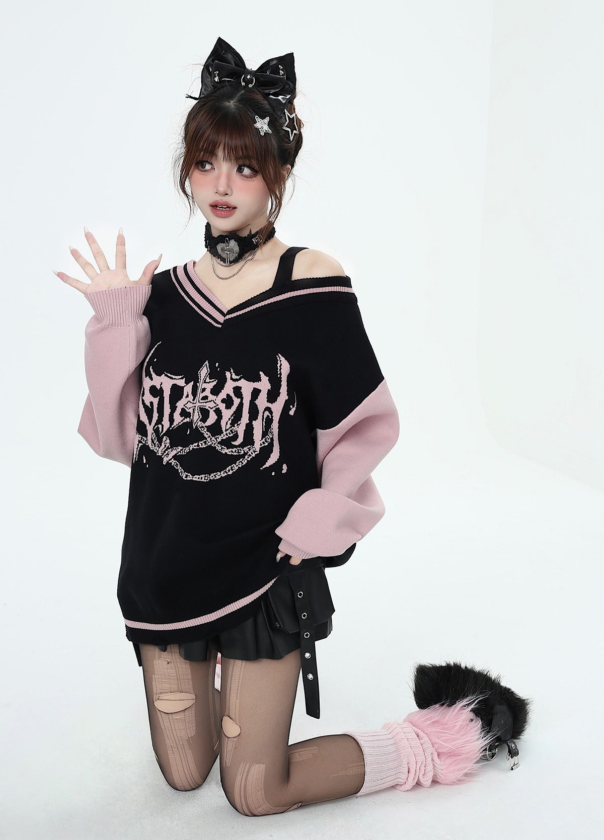 Black and pink V-neck off-shoulder sweater